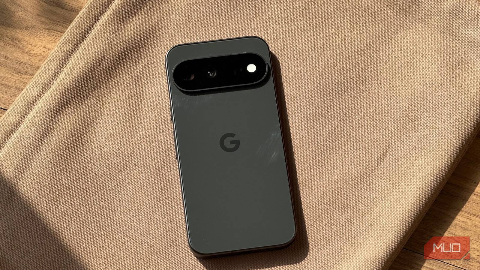 Google Pixel 11 design and sitting on a laptop sleeve