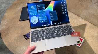 The Dell XPS Googlebook in the hand.