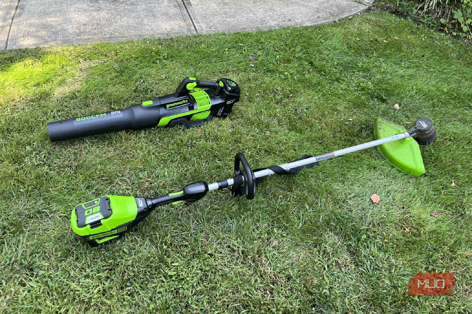Greenworks string trimmer and leaf blower on grass