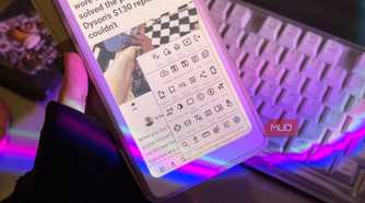 Hand holding the Palma 2 Pro with EinkBro toolbar menu open above a keyboard