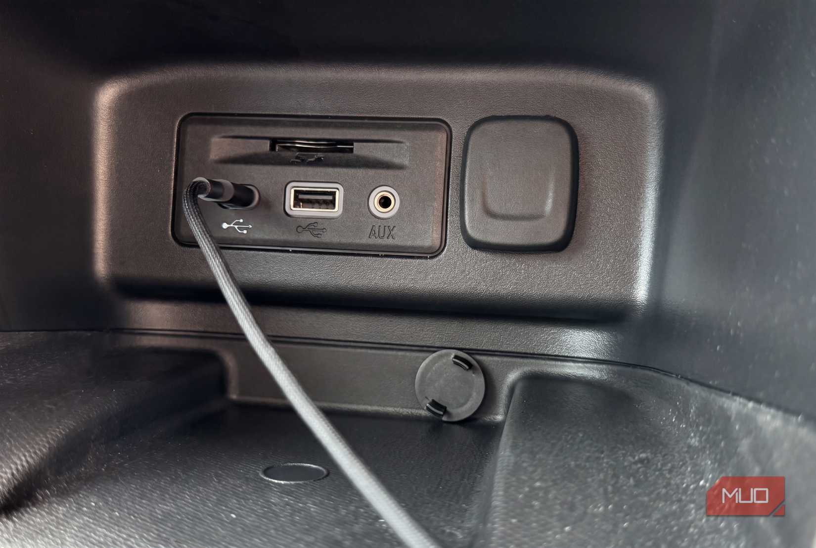 USB plugs inside a car.