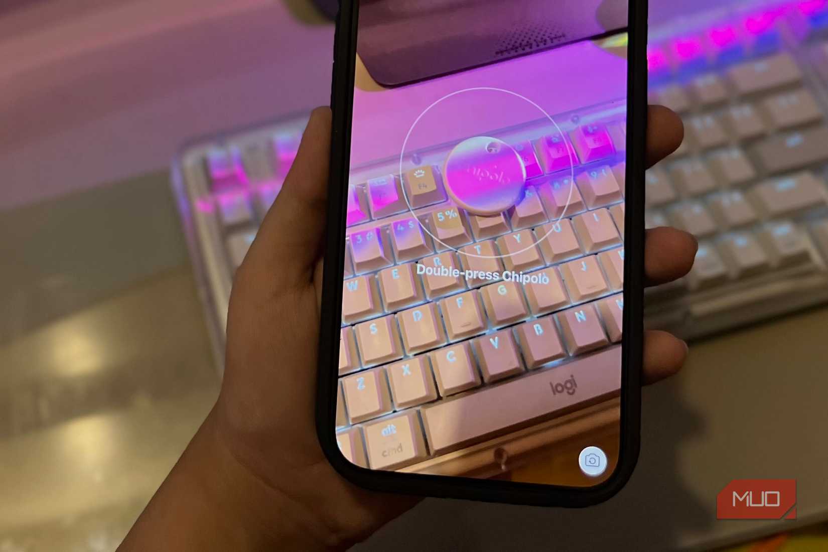 iPhone camera AR prompt to double-press Chipolo tag on keyboard