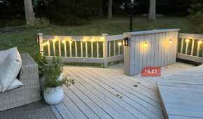 A couch and a deck with lights