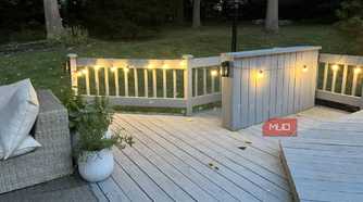 A couch and a deck with lights