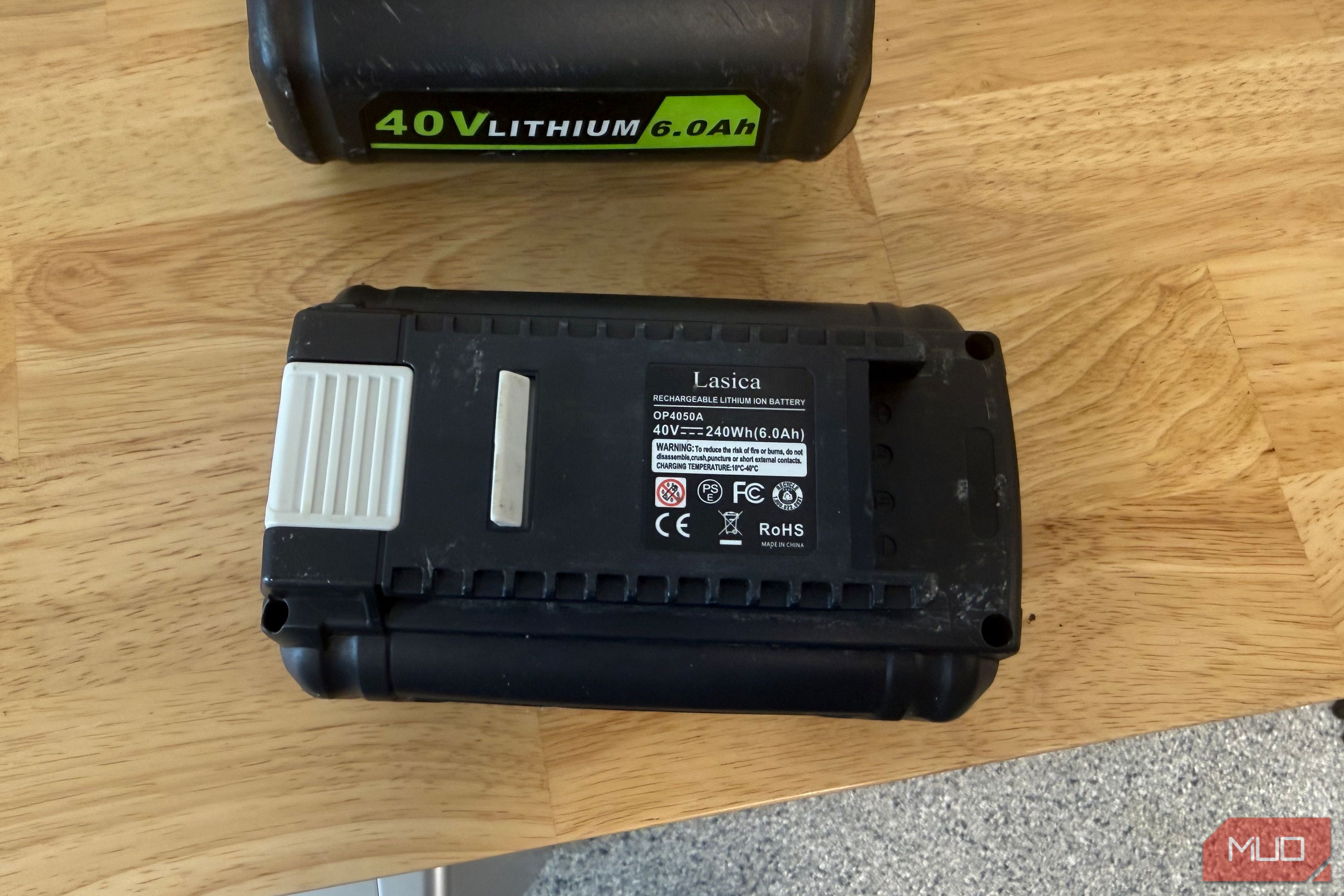 off-brand ryobi 40V battery showing rear spec label on wood table