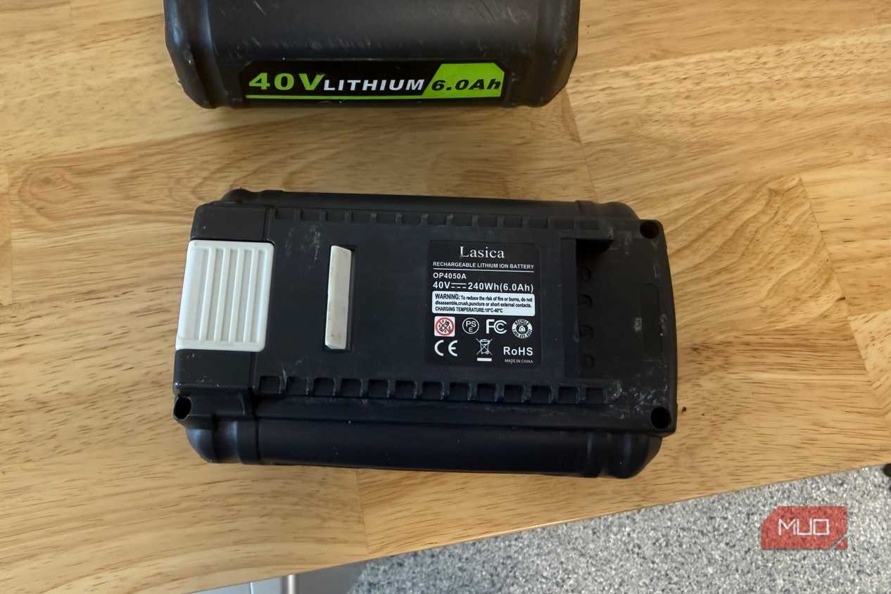 off-brand ryobi 40V battery showing rear spec label on wood table