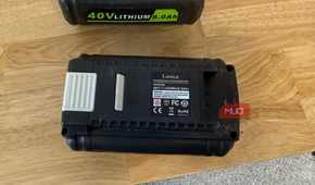 off-brand ryobi 40V battery showing rear spec label on wood table