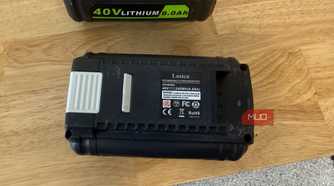 off-brand ryobi 40V battery showing rear spec label on wood table
