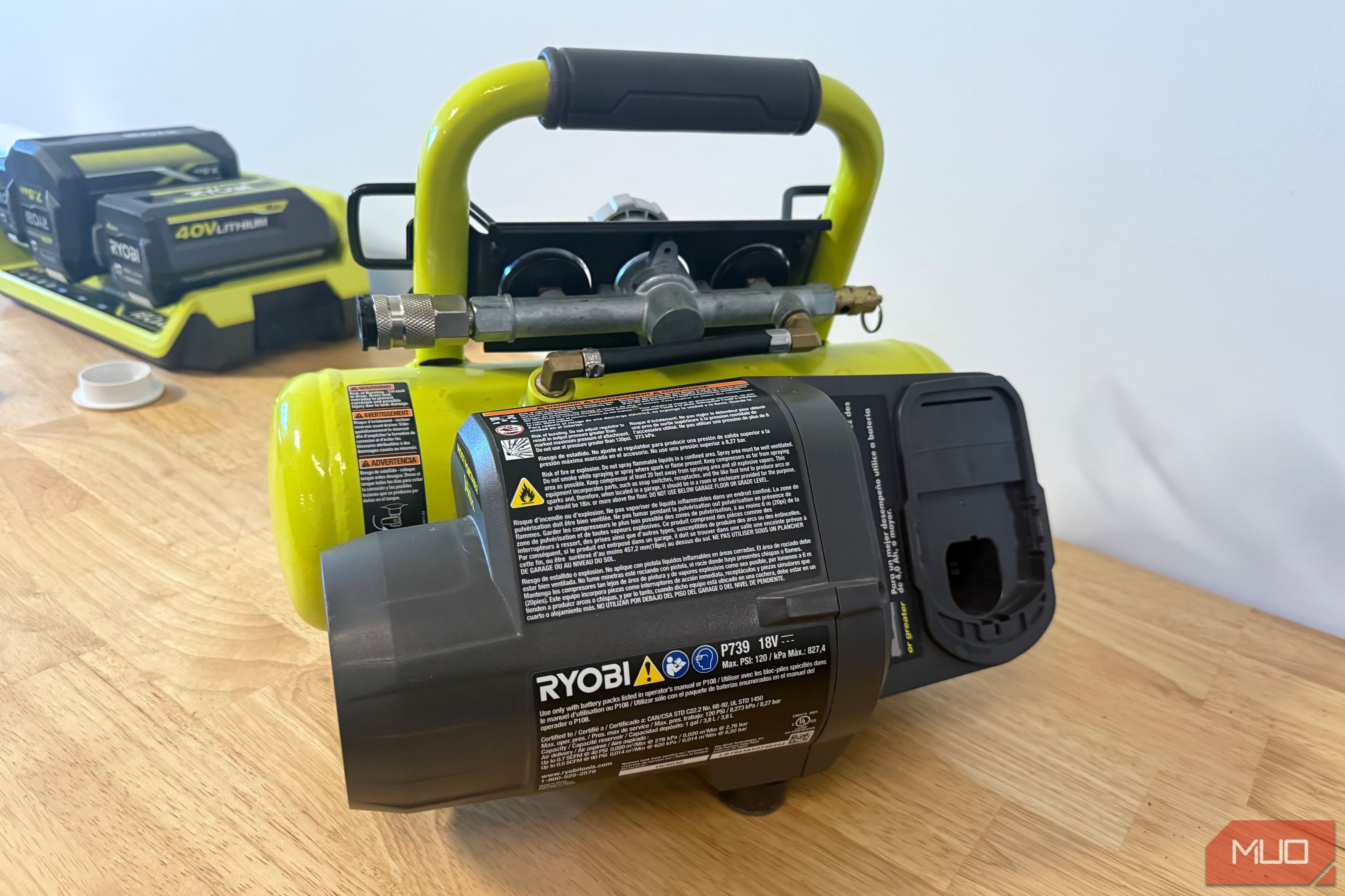 Ryobi cordless compressor rear view showing motor and label
