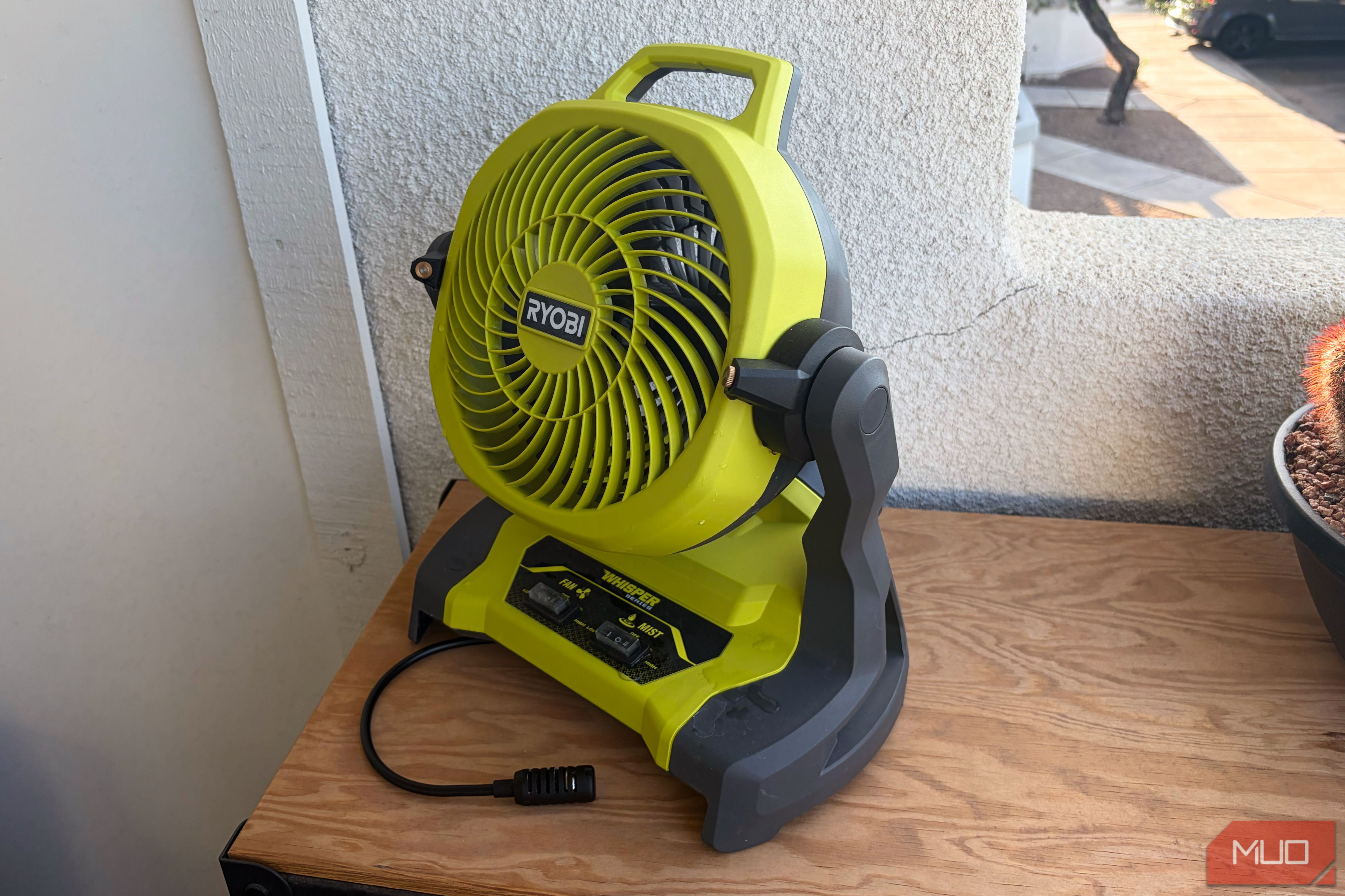 The Ryobi bucket top misting fan on a tool chest.