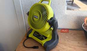 The Ryobi bucket top misting fan on a tool chest.
