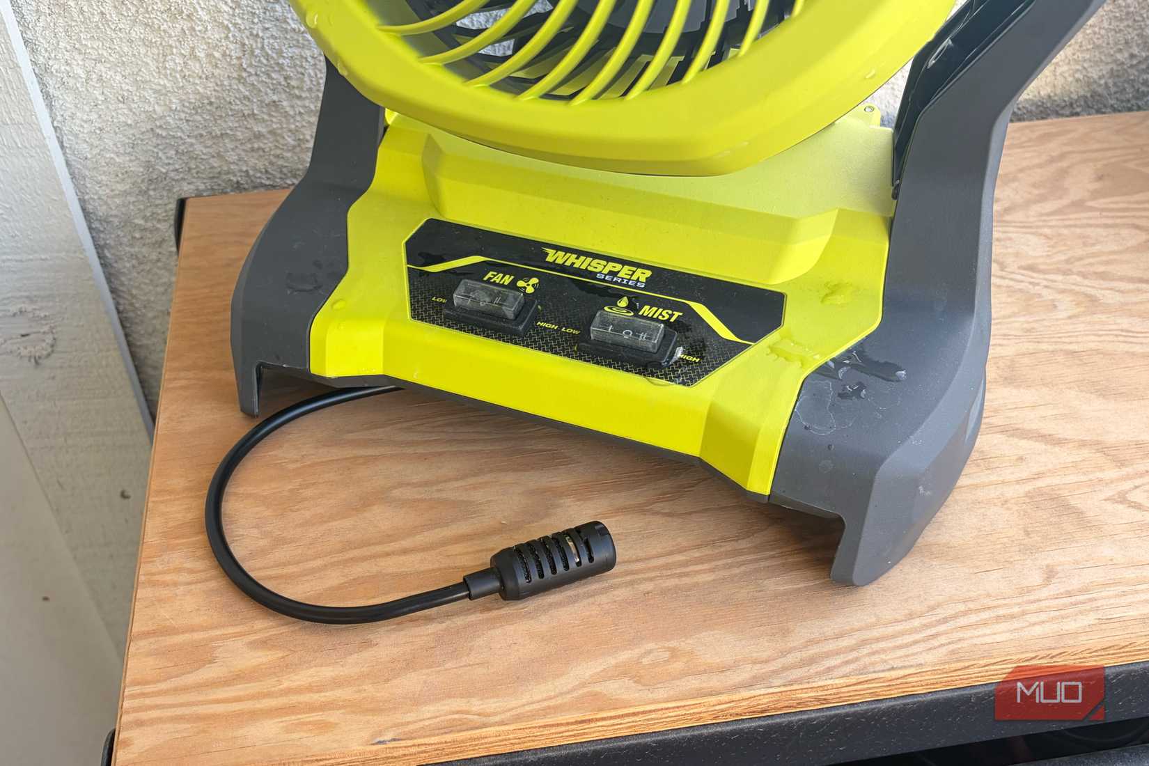 The pump hose and controls on the Ryobi bucket top misting fan.