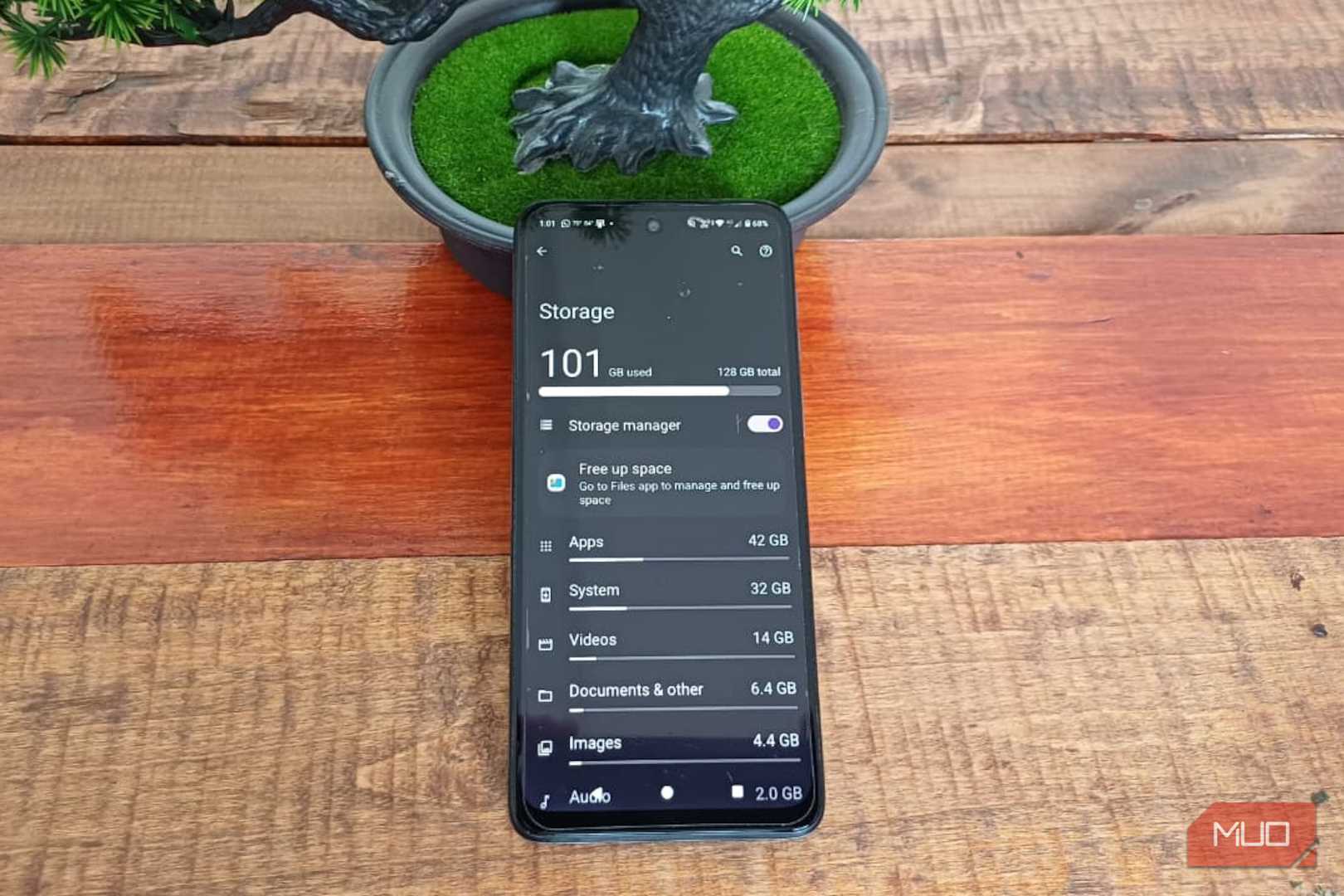 Android Storage on a Samsung Galaxy A34 showing 101GB of 128GB used, with apps, system, videos, documents, and images broken down by storage use