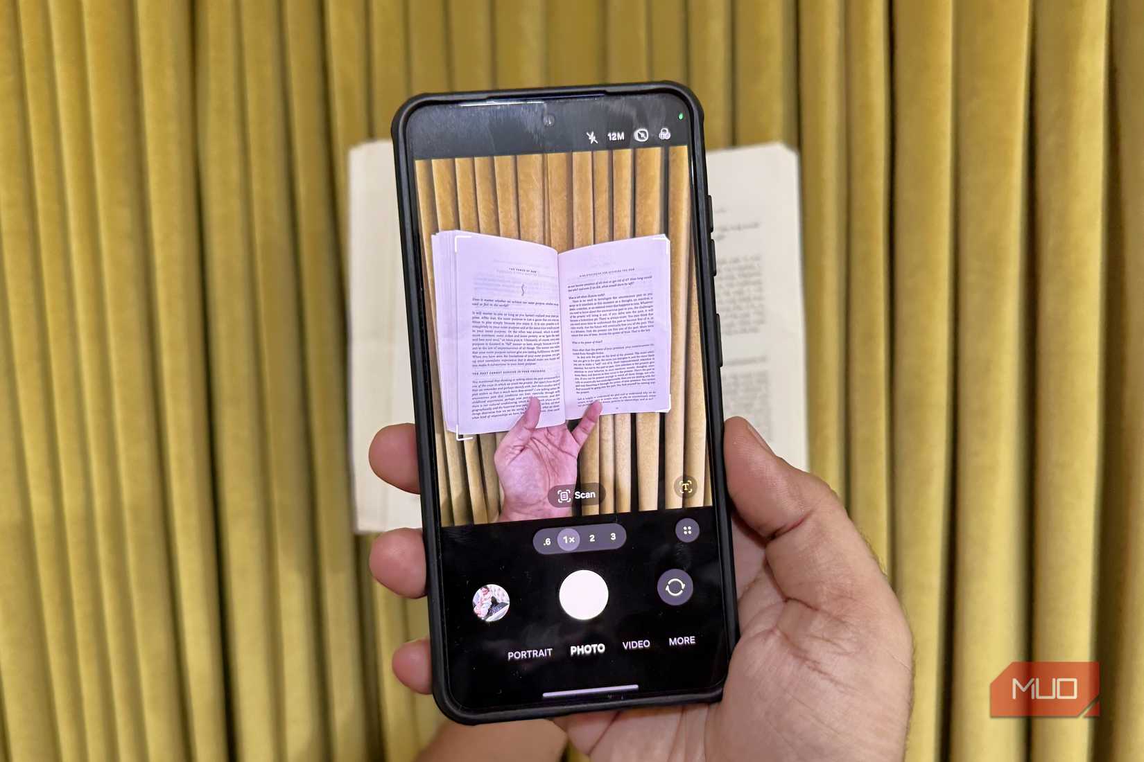 Samsung phone in hand showing One UI 9 document scanner