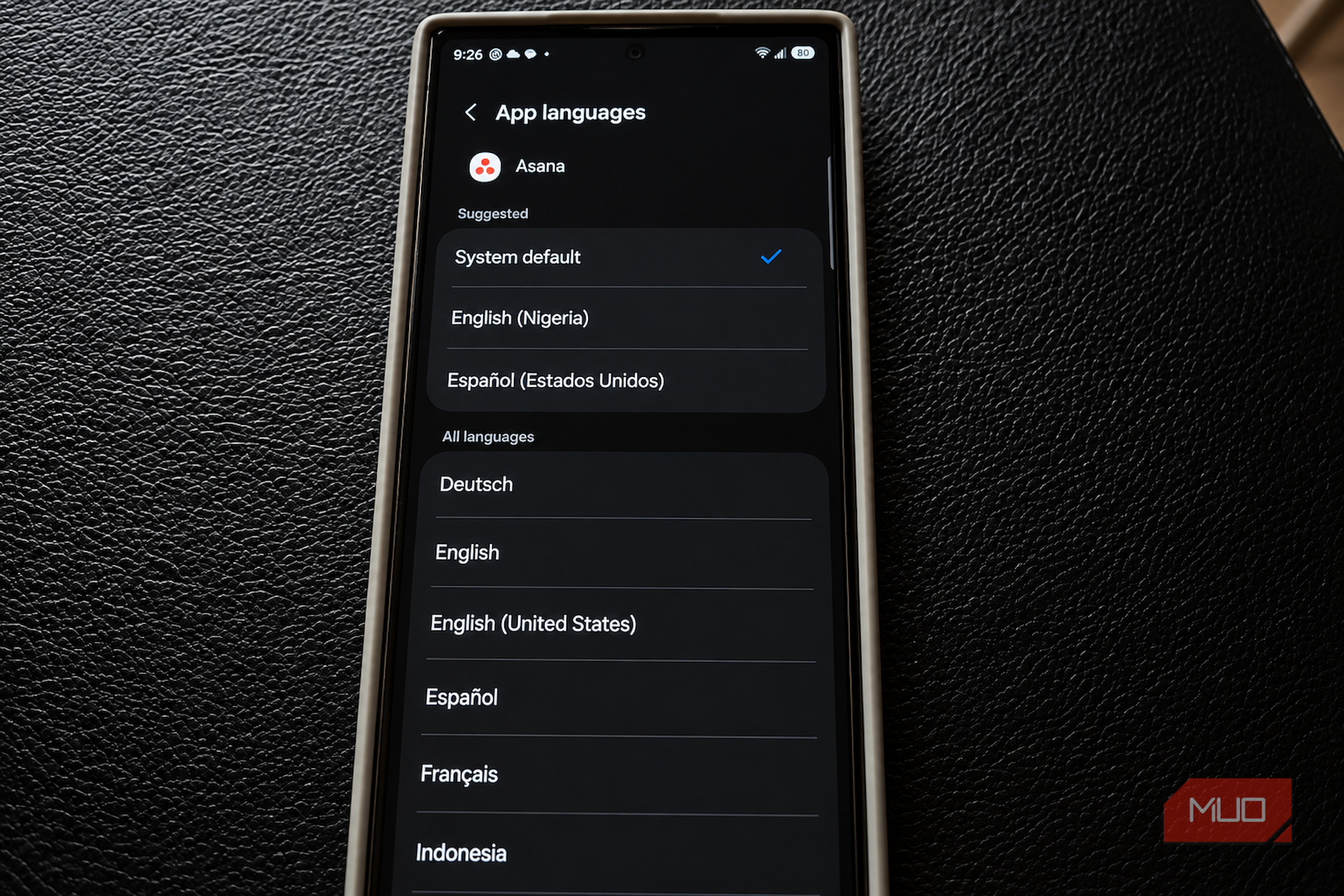 Smartphone displaying Asana app language settings.