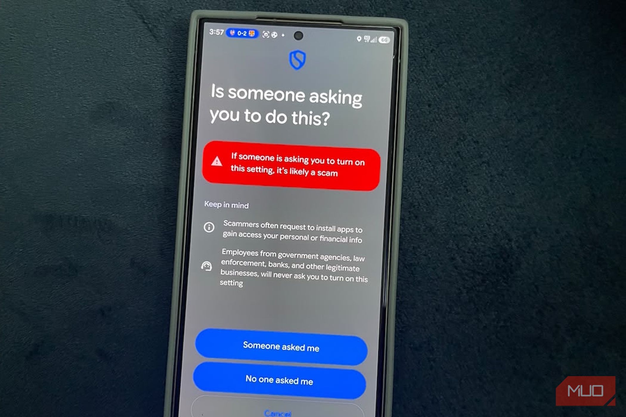 Smartphone screen warning about potential scam alert