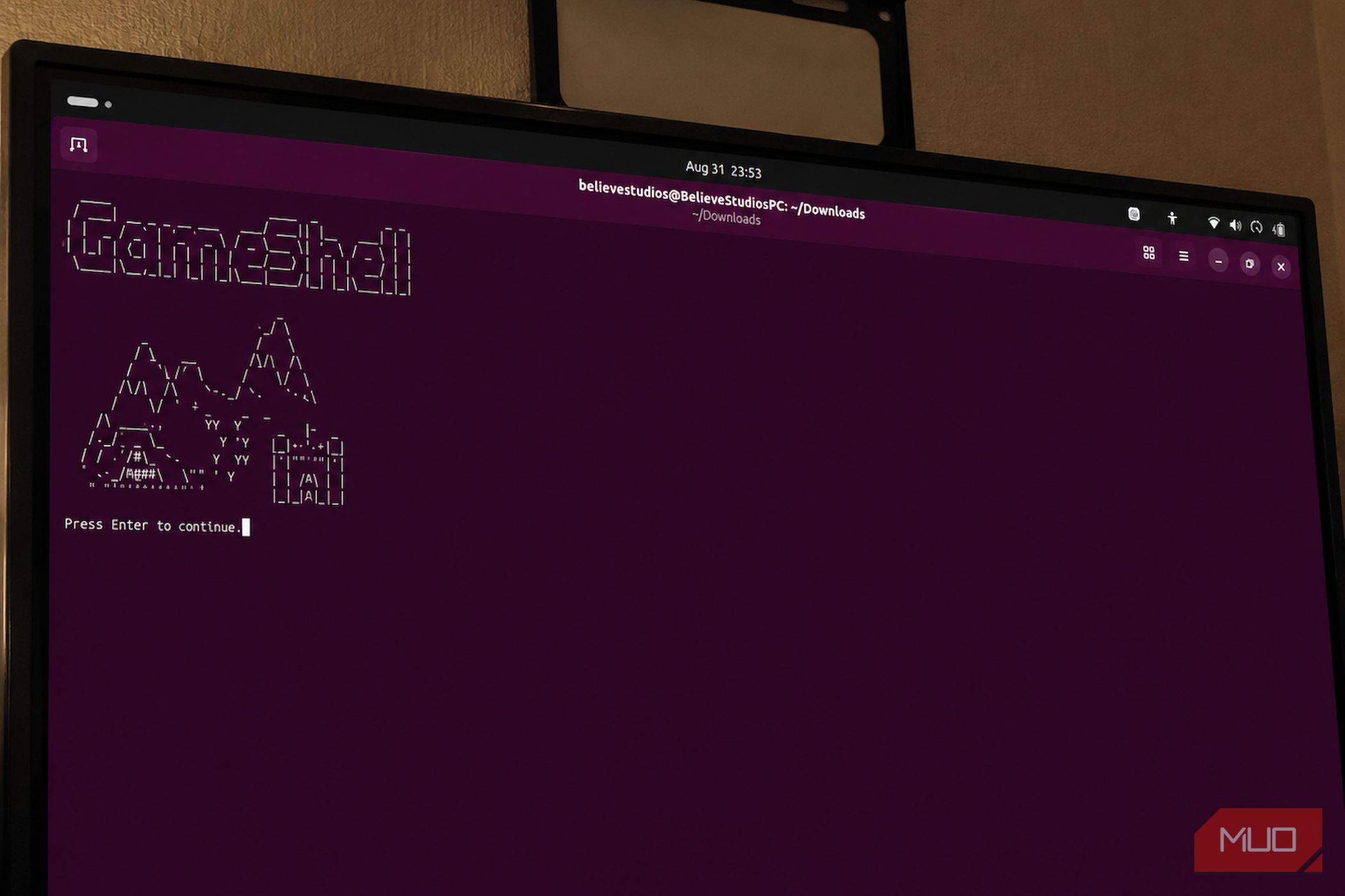 Terminal displaying GameShell ASCII art on monitor.