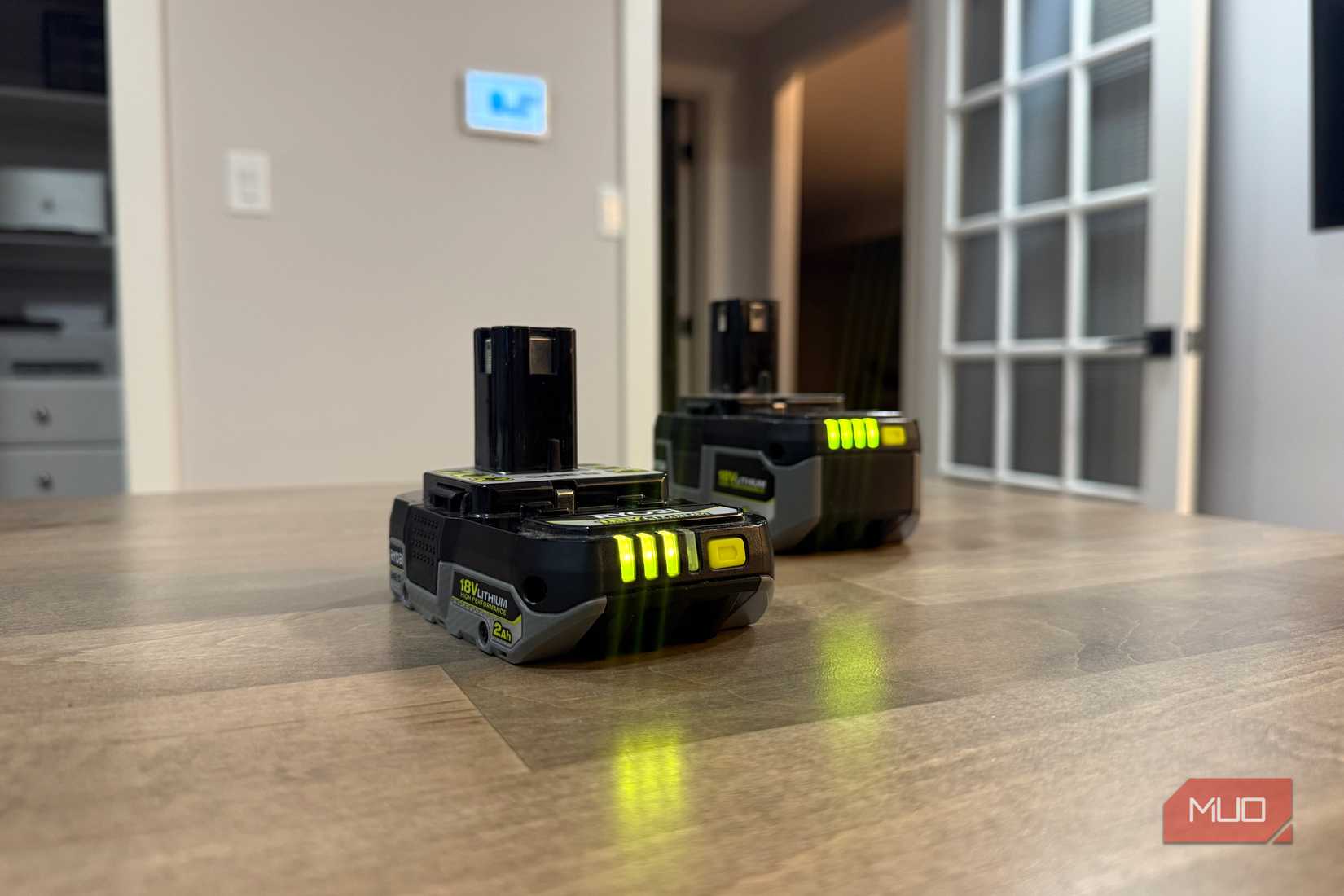 two ryobi batteries on desk-1