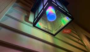 Underside of a ceiling lantern with a Linkind bulb in rainbow colors