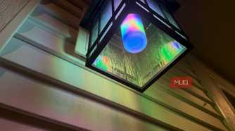 Underside of a ceiling lantern with a Linkind bulb in rainbow colors