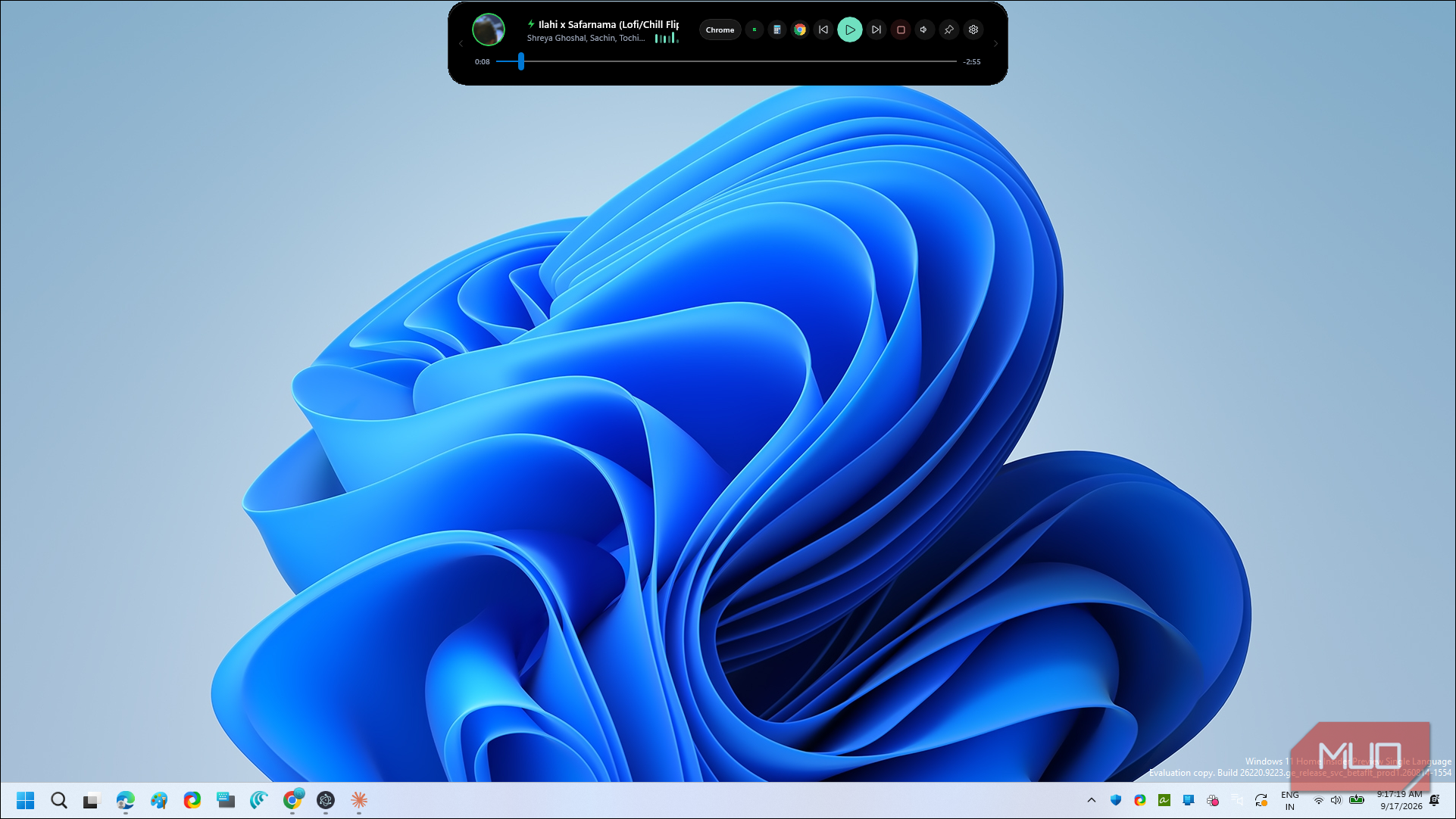 windows 11 blue abstract flower wallpaper with music player overlay
