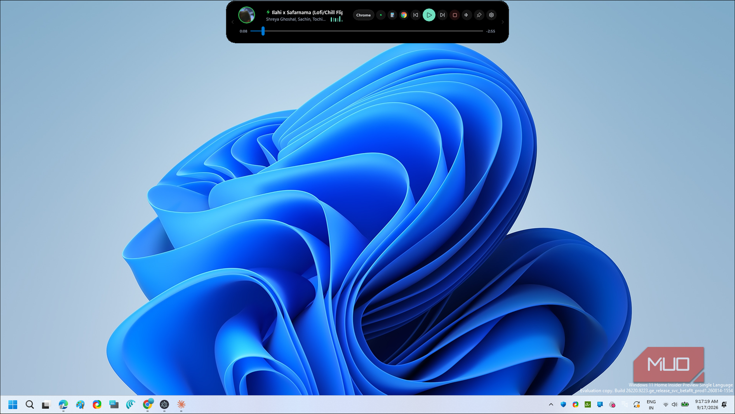 windows 11 blue abstract flower wallpaper with music player overlay