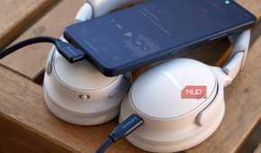 A pair of USB-C headphones connected to an Android phone.