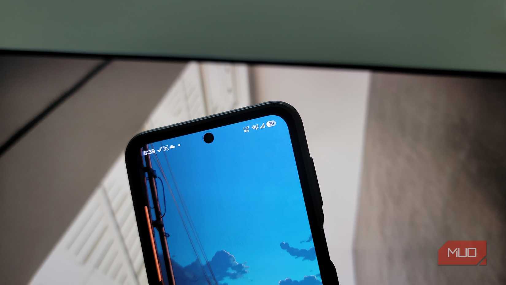 android smartphone displaying blue sky wallpaper with status bar