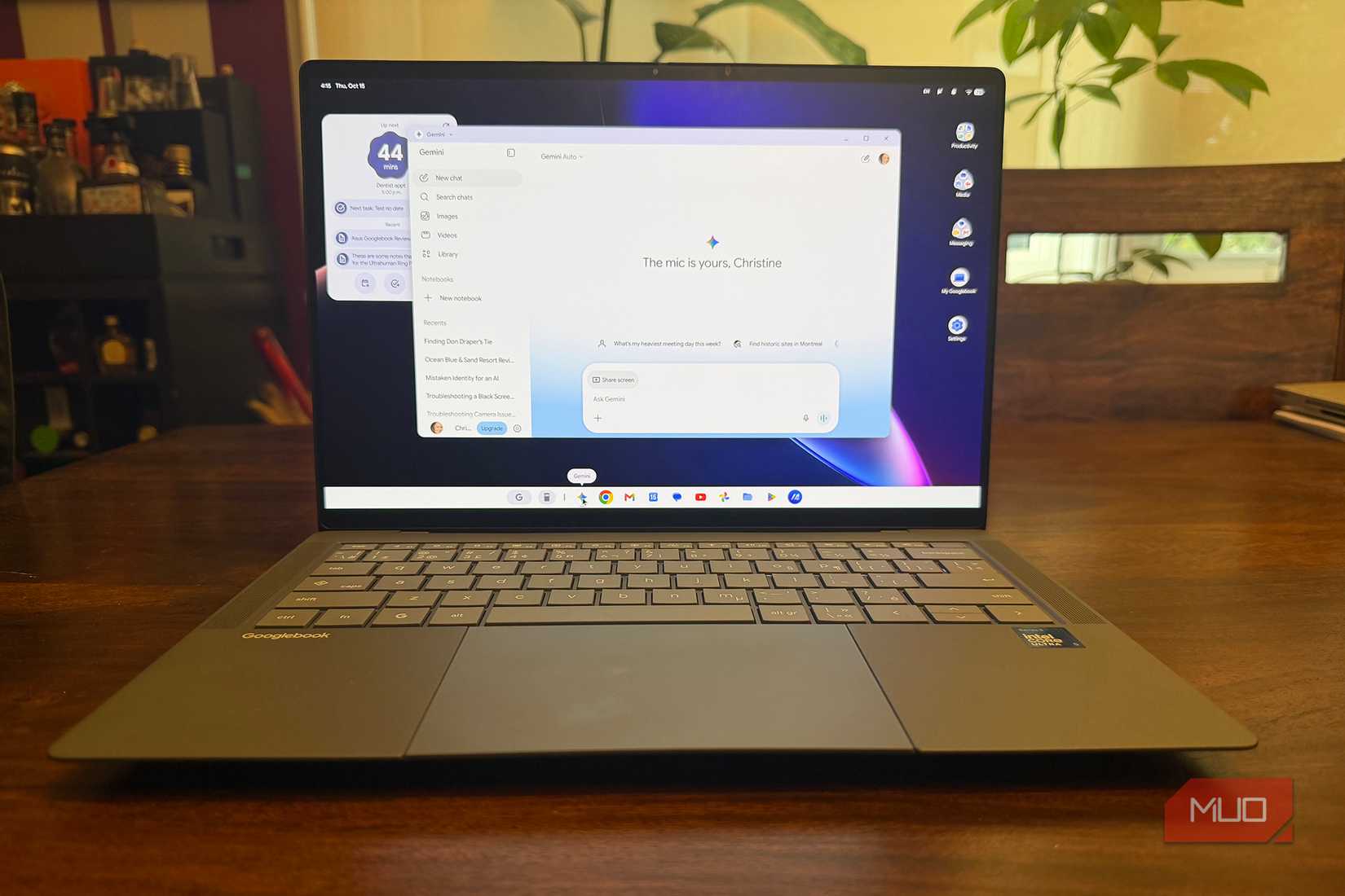 An Asus Googlebook 14 on a table showing a Gemini open window.
