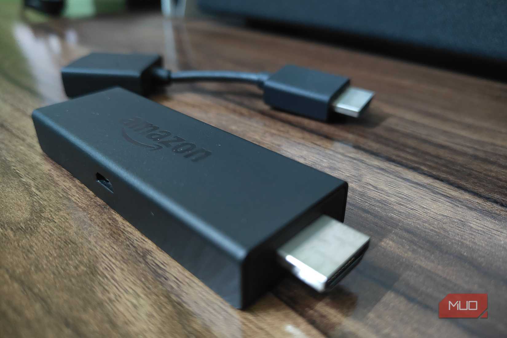Fire TV Stick and HDMI extension on a table