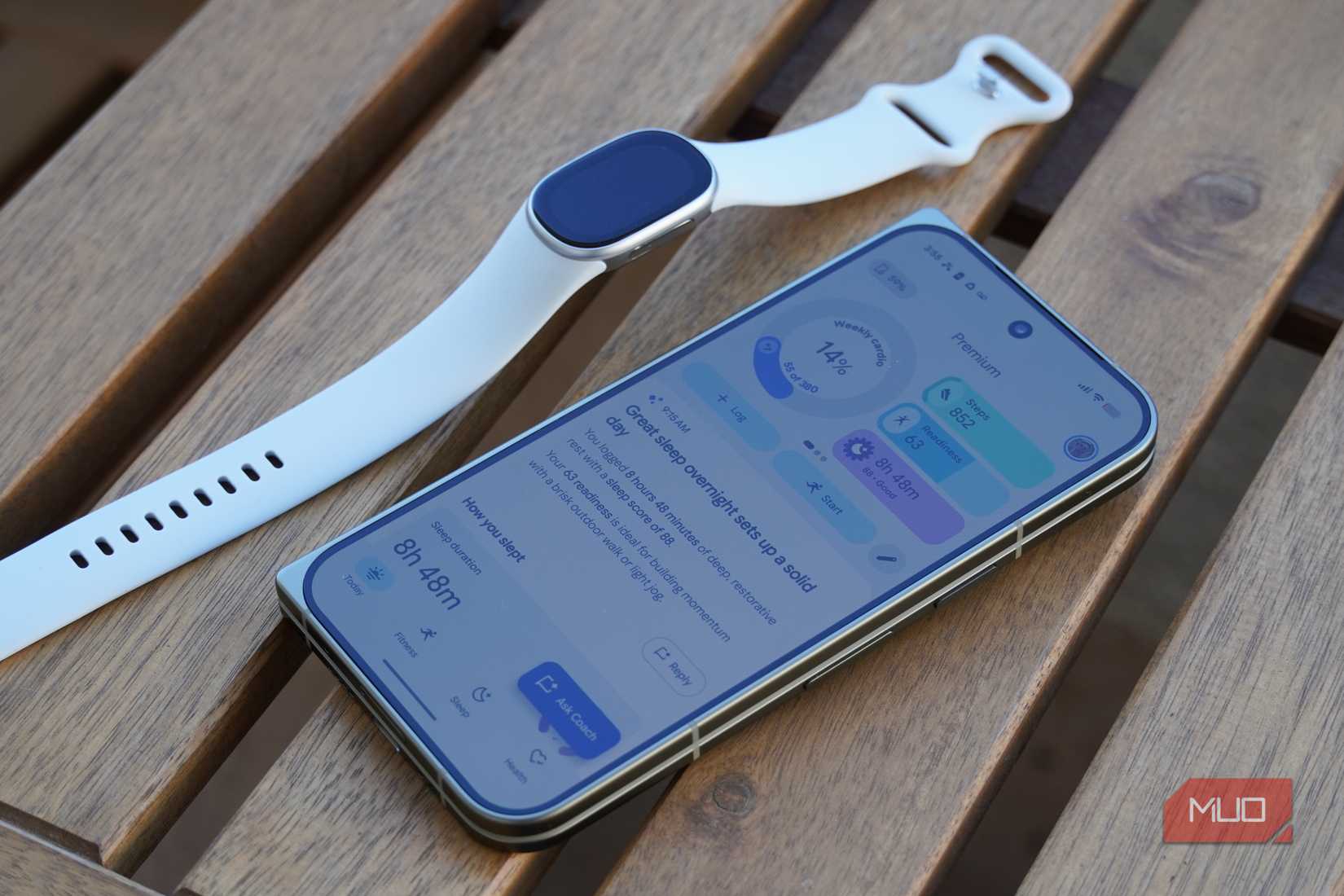 The Fitbit Edge beside the Google Health app.