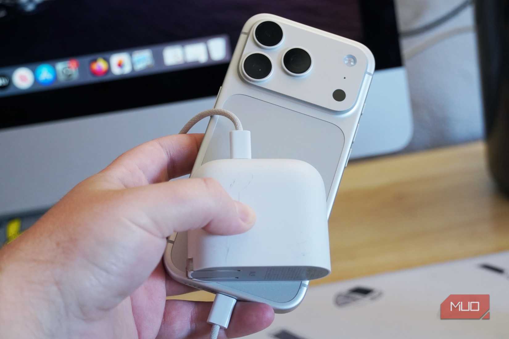 An iPhone held with a PPS/AVS charger.