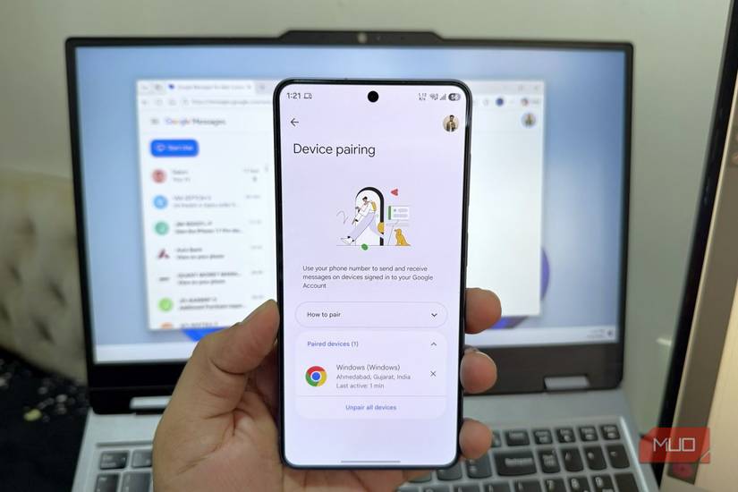 Phone in hand showing Device Pairing menu with laptop in the background