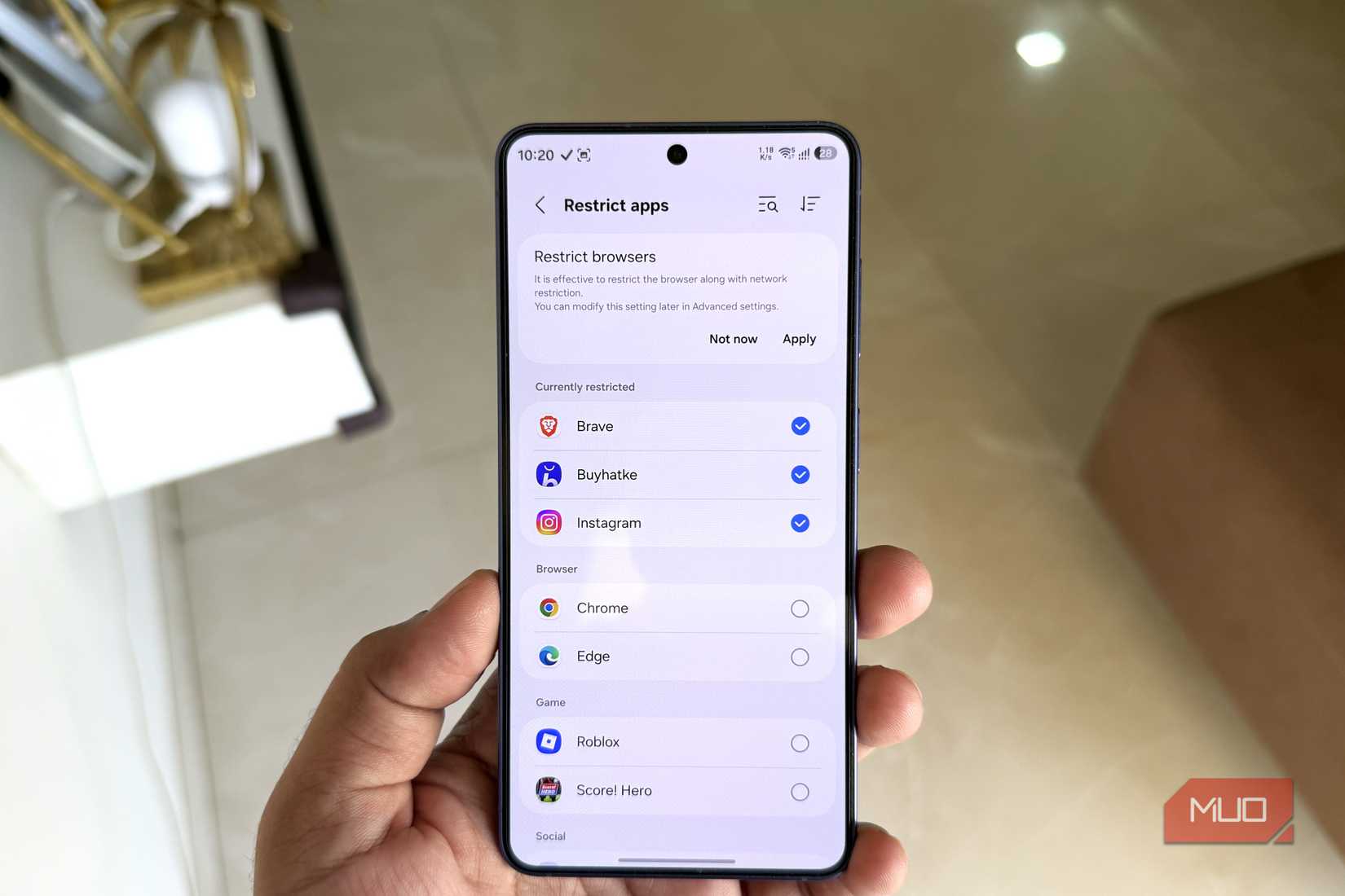 Samsung Phone in hand showing AI Network Guard feature