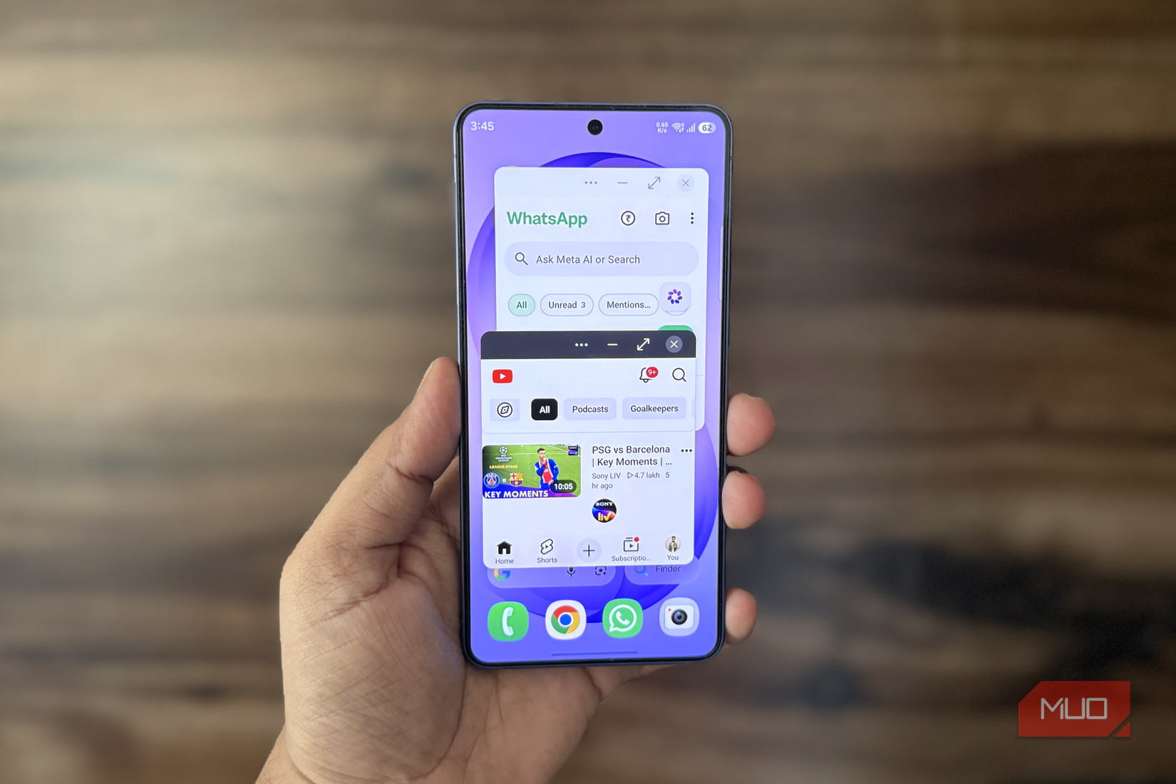 Samsung phone in hand showing windowed mode for apps