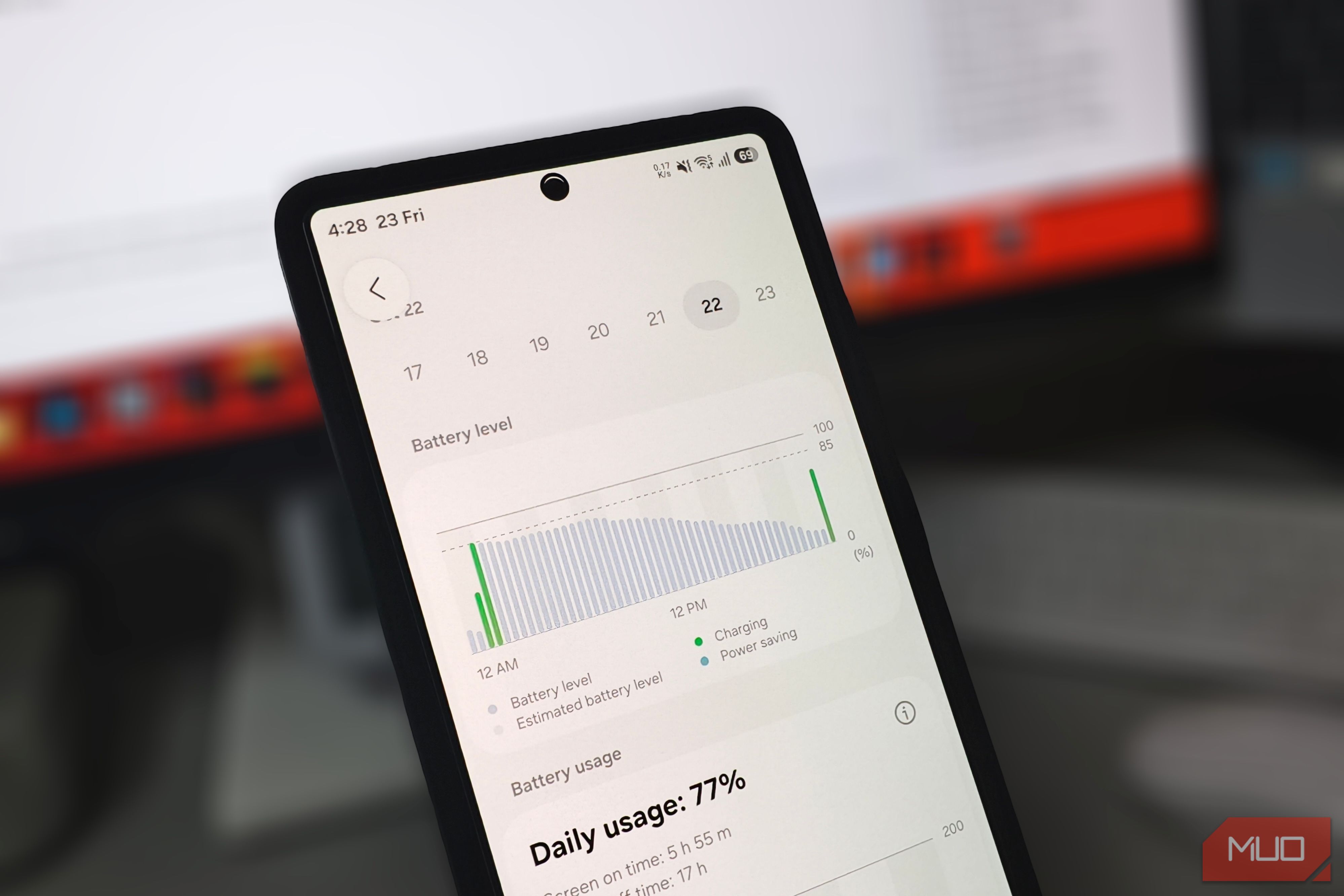 Smartphone displaying battery level graph on desk