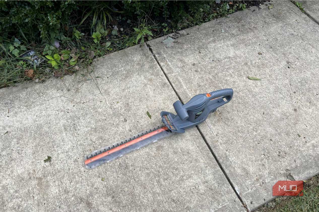 The sidewalk with a Scotts Corded Hedge Trimmer