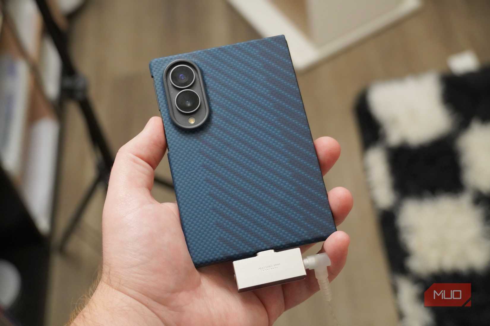 The Linsoul Allegro Mini DAC plugged into a smartphone.